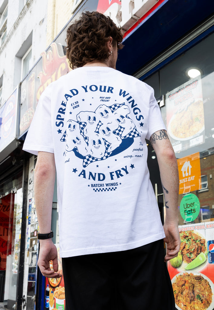 model wearing large back print of spread your wings and fry tshirt