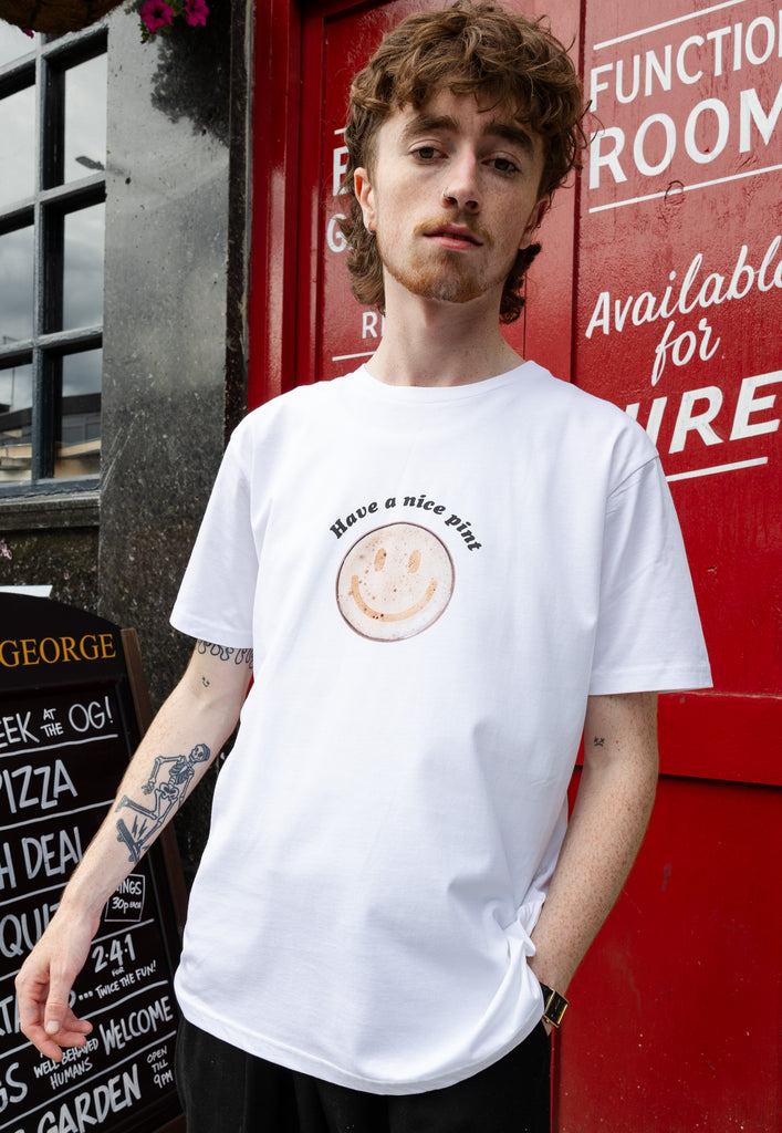 male model wears unisex white t shirt with beer graphic and slogan print to front