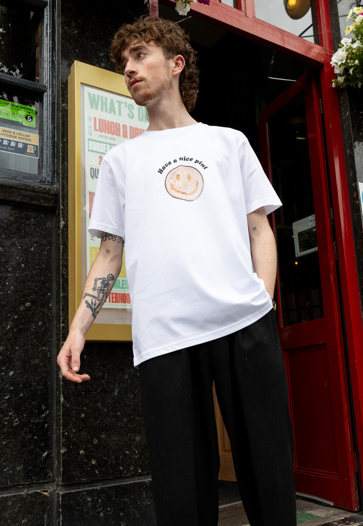 male model wears white tee with fun beer slogan print