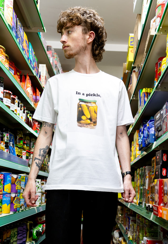 model is wearing small front pickle photo printed tshirt in white