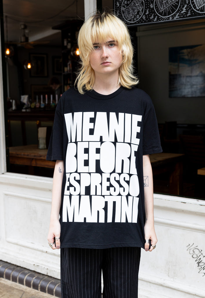 female model wears unisex black t shirt with espresso martini slogan in white print