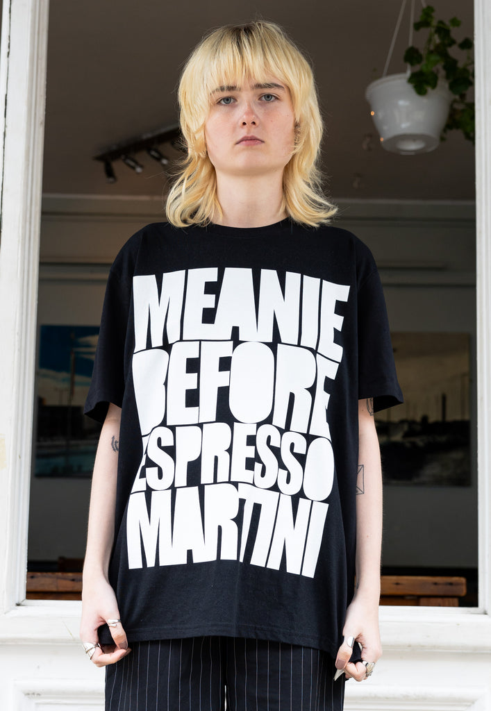 female model wears unisex black t shirt with espresso martini slogan in white print