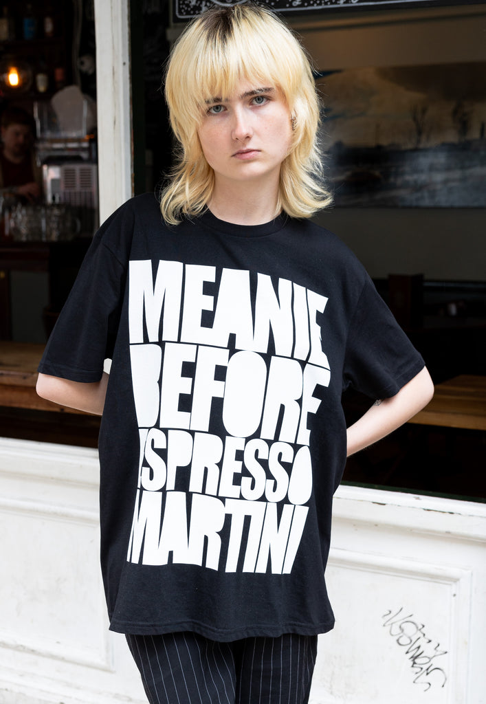 female model wears unisex black t shirt with espresso martini slogan in white print