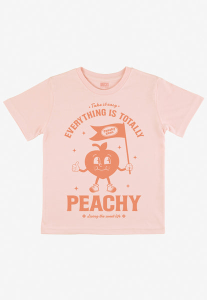 children's printed t shirt in pastel peach with cute peach character graphic and positive slogan