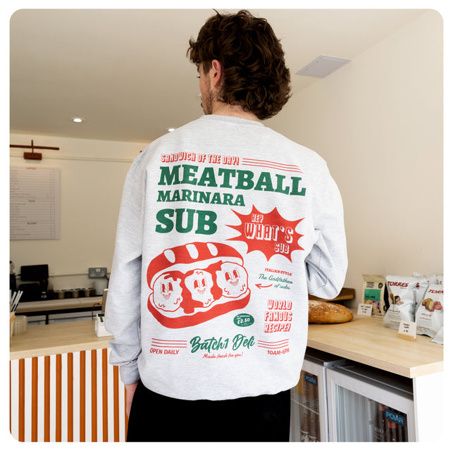 model wearing meatball graphic sweatshirt in grey 
