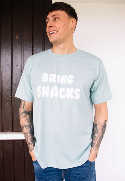 Model wears bring snacks graphic print tshirt