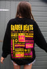 Model wears black sweatshirt with printed neon Garden Beats slogan