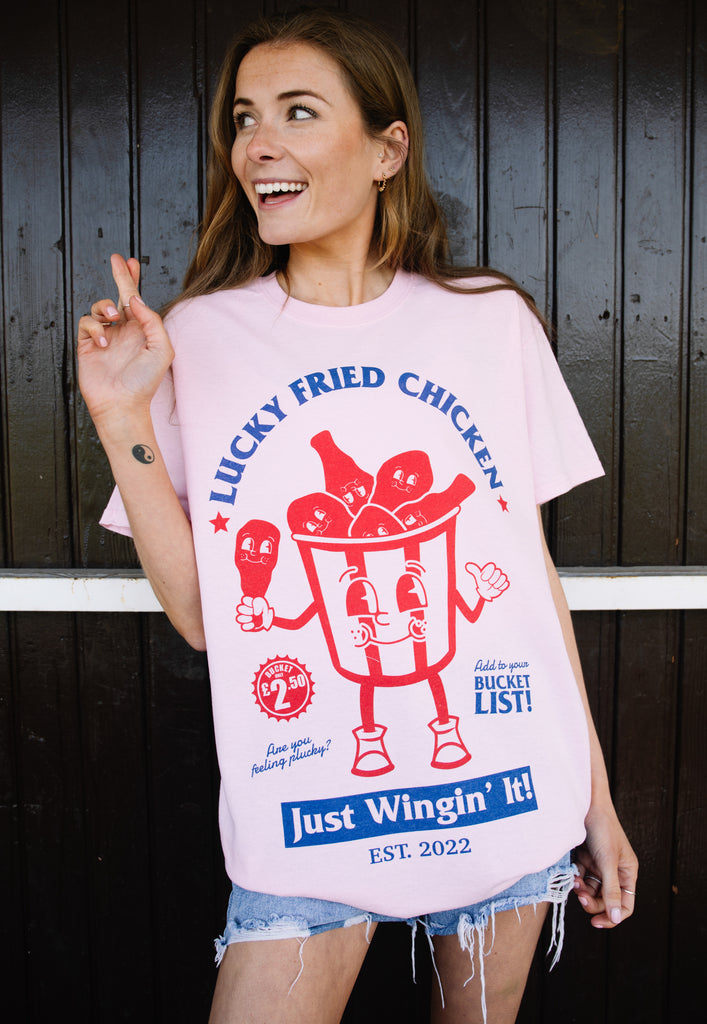 Model wears chicken bucket character graphic printed tshirt