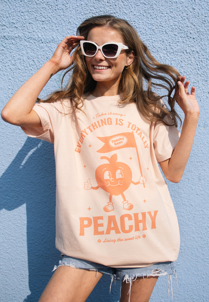 Model wears positive slogan graphic printed tshirt
