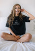 Model wears black t-shirt printed with Do Not Disturb slogan on front 