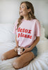 Model wears pink slogan t-shirt with printed detox please slogan