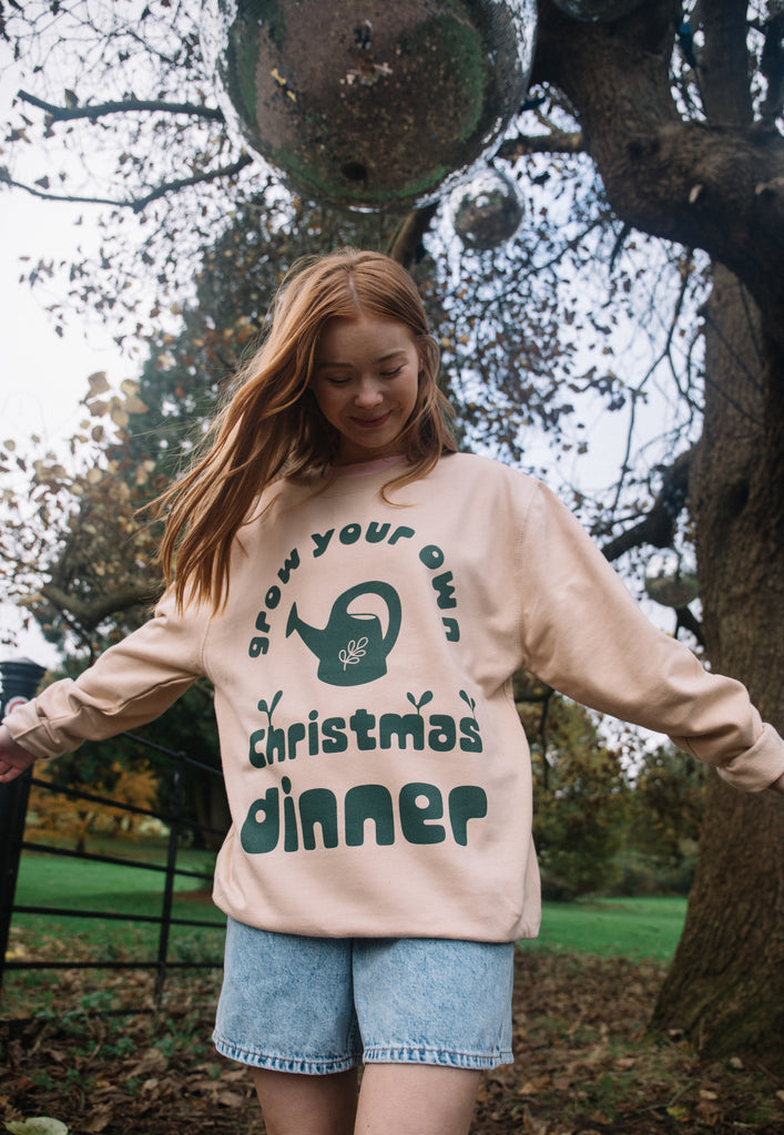 christmas jumper for women in sand colour with gardneing graphics and grow your own slogan