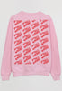 flatlay of pink sweatshirt showing repeated cherry logo in red print on back of garment