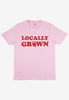 Flatlay of pink tshirt with locally grown printed slogan 