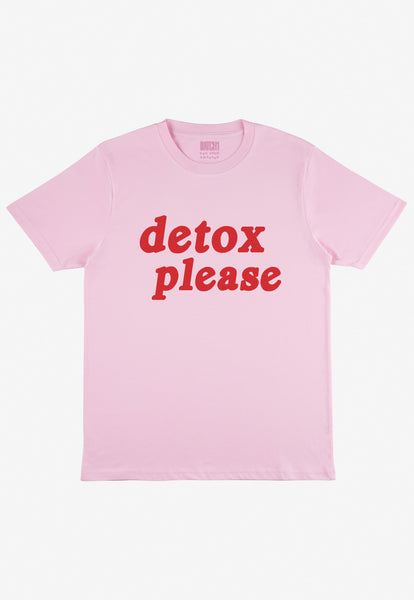 Flatlay of light pink t-shirt with printed detox slogan on front