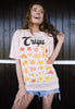 Model wears dusty peach tshirt with A guide to Crisps slogan and crisps character graphic