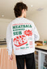 Model is wearing large back meatball marinara sub batch1 deli graphic print jumper in grey