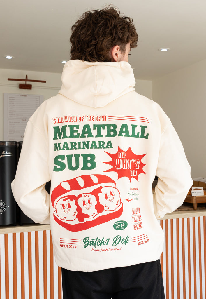 Model wears large back print meatball marinara sub graphic hoodie in vanilla