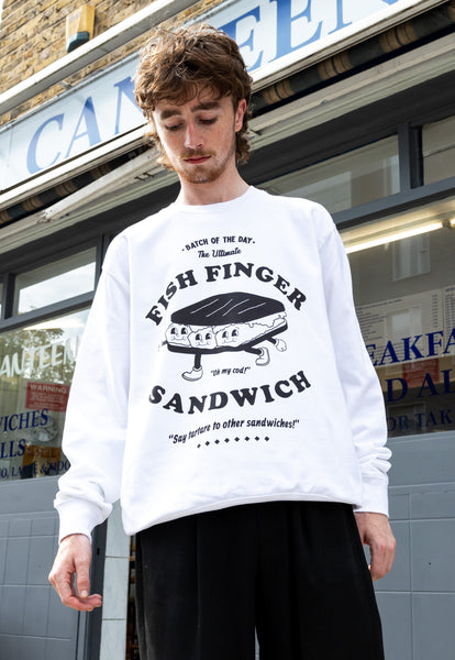Model wears fish finger sandwich character graphic print sweatshirt in white