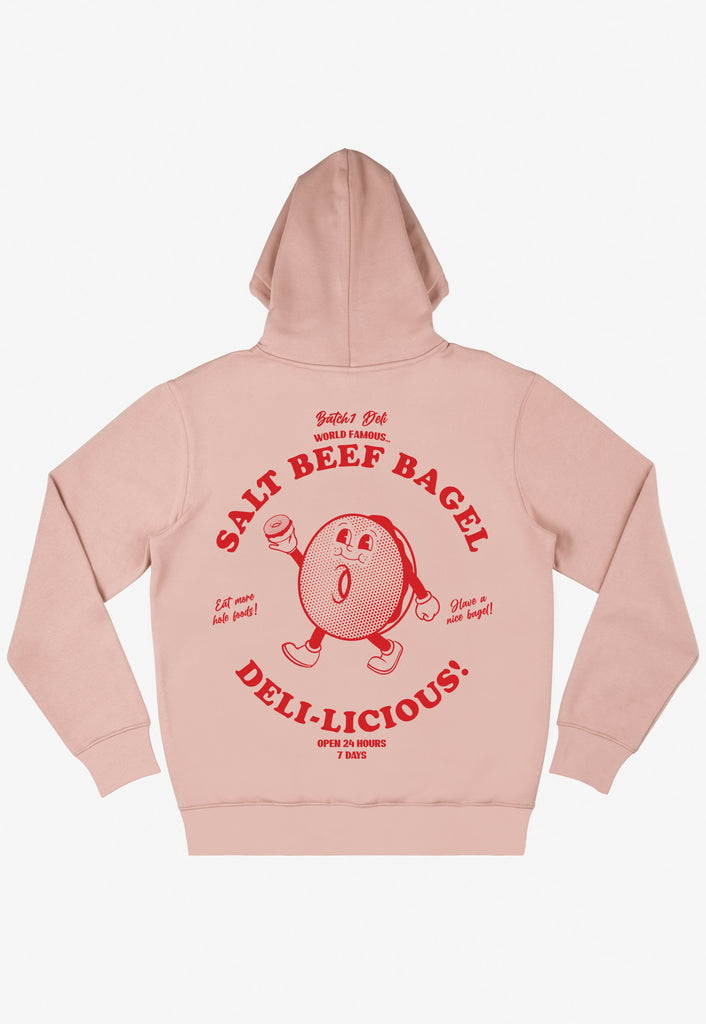 unisex hoodie in neutral peach with large graphic back print showing salt beef bagel logo and mascot bagel character