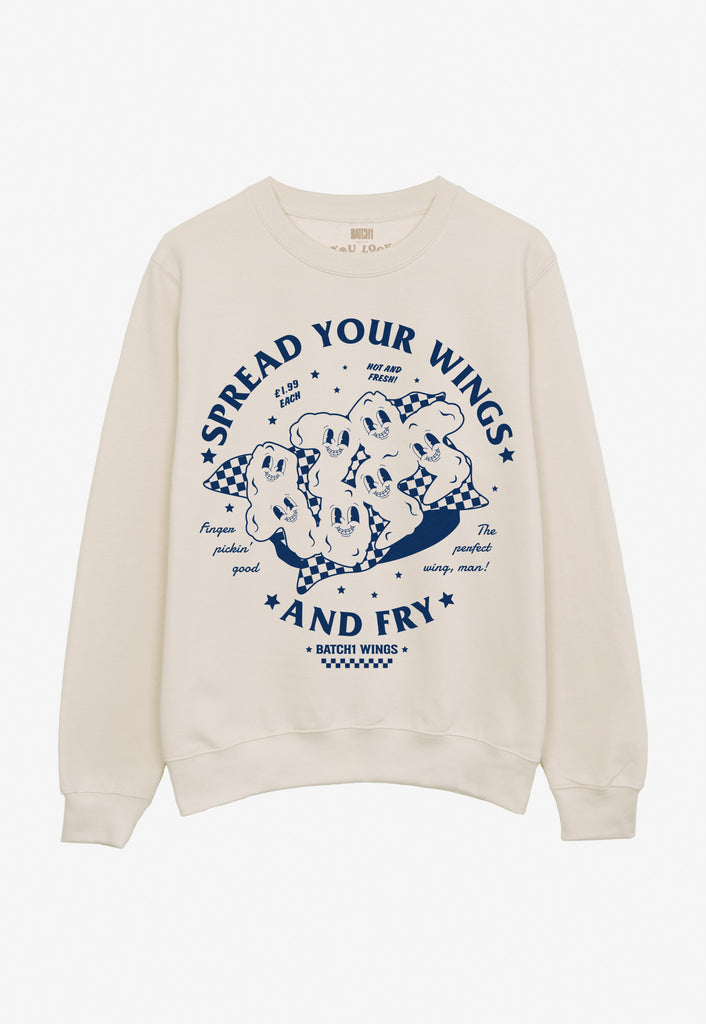Flatlay of spread your wings and fry slogan graphic print sweatshirt in vanilla