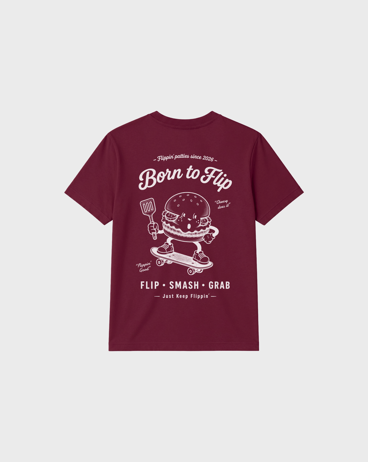 Back flat lay of the Born to Flip burgundy T-shirt with a large white skateboarding burger graphic and lettering.