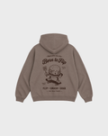 Back flat lay of the Born to Flip taupe oversized hoodie with a large brown skateboarding burger graphic beneath the hood.