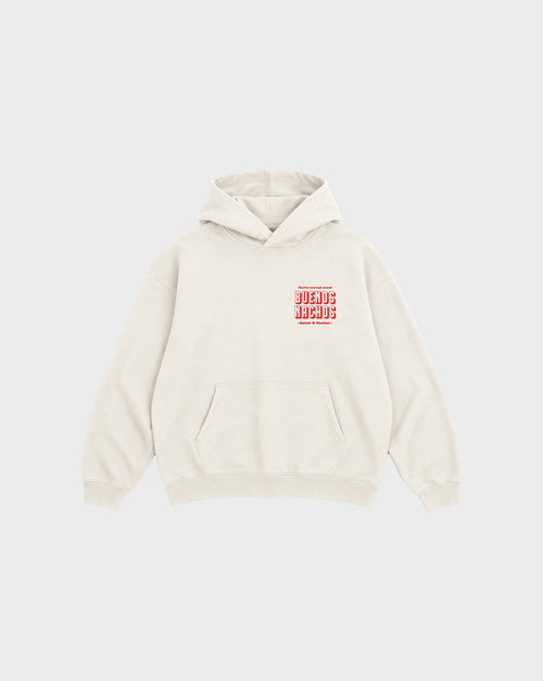 Front flat lay of the Buenos Nachos ivory oversized hoodie, showing the small red lettering on the left chest.