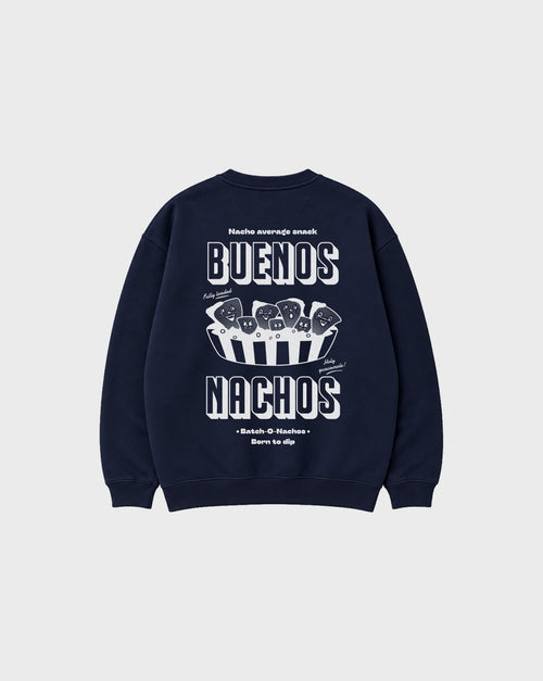 Back flat lay of the Buenos Nachos navy oversized sweatshirt, showing the large white nacho illustration and Buenos Nachos lettering on the back.
