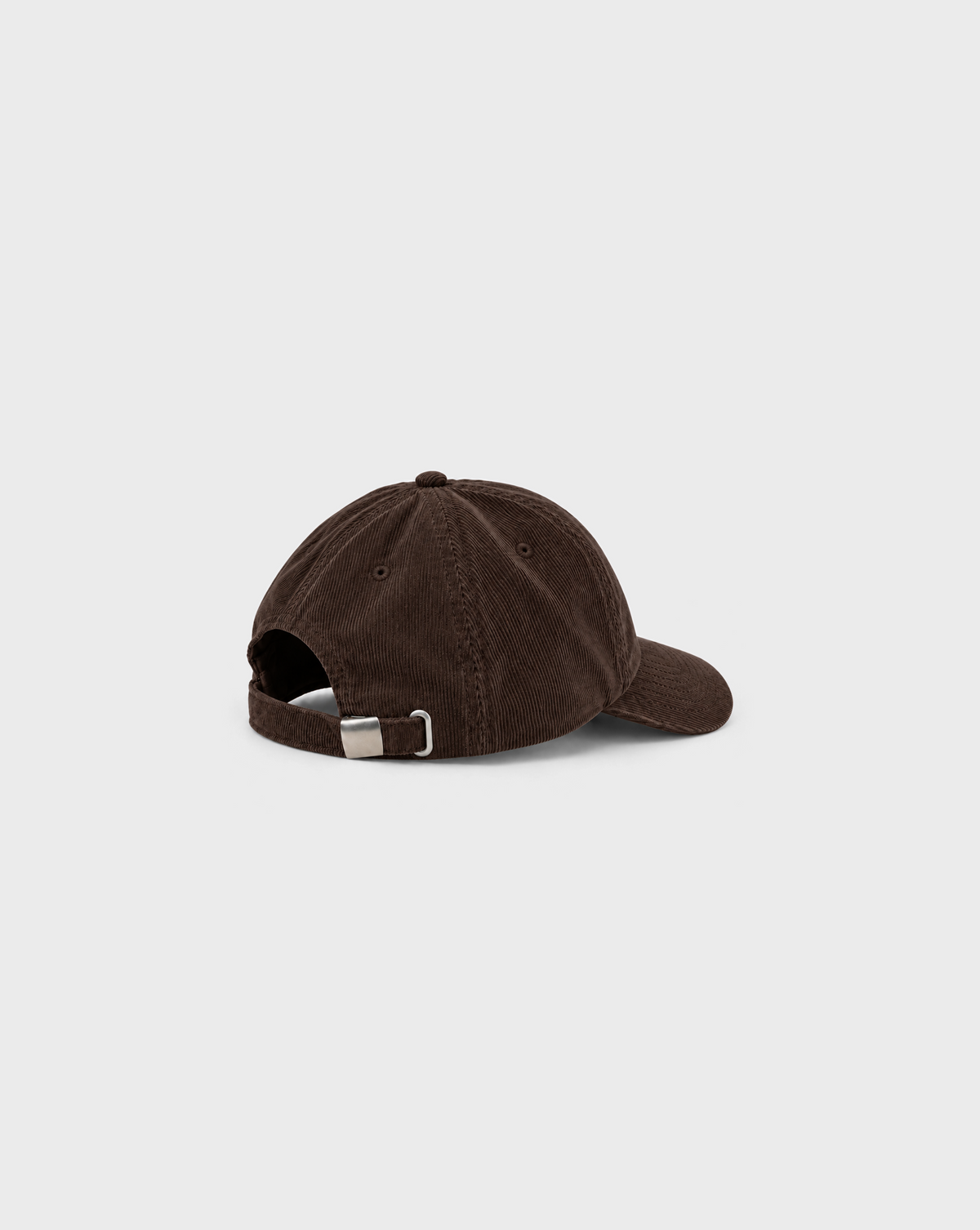 Daily Grind Cord Cap in Brown, side view showing the natural corduroy fabric and curved peak.