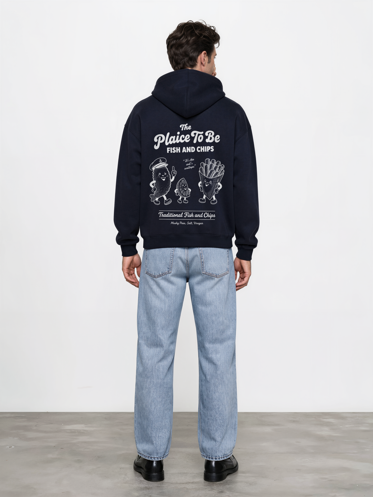 Navy Fish and Chips The Plaice To Be hoodie, male model back view with white large back graphic