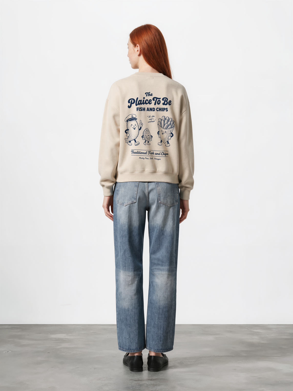 Stone Fish and Chips The Plaice To Be sweatshirt, female model back view with navy large back graphic