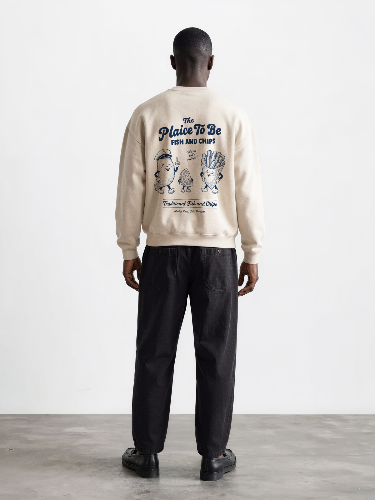 Stone Fish and Chips The Plaice To Be sweatshirt, male model back view with navy large back graphic