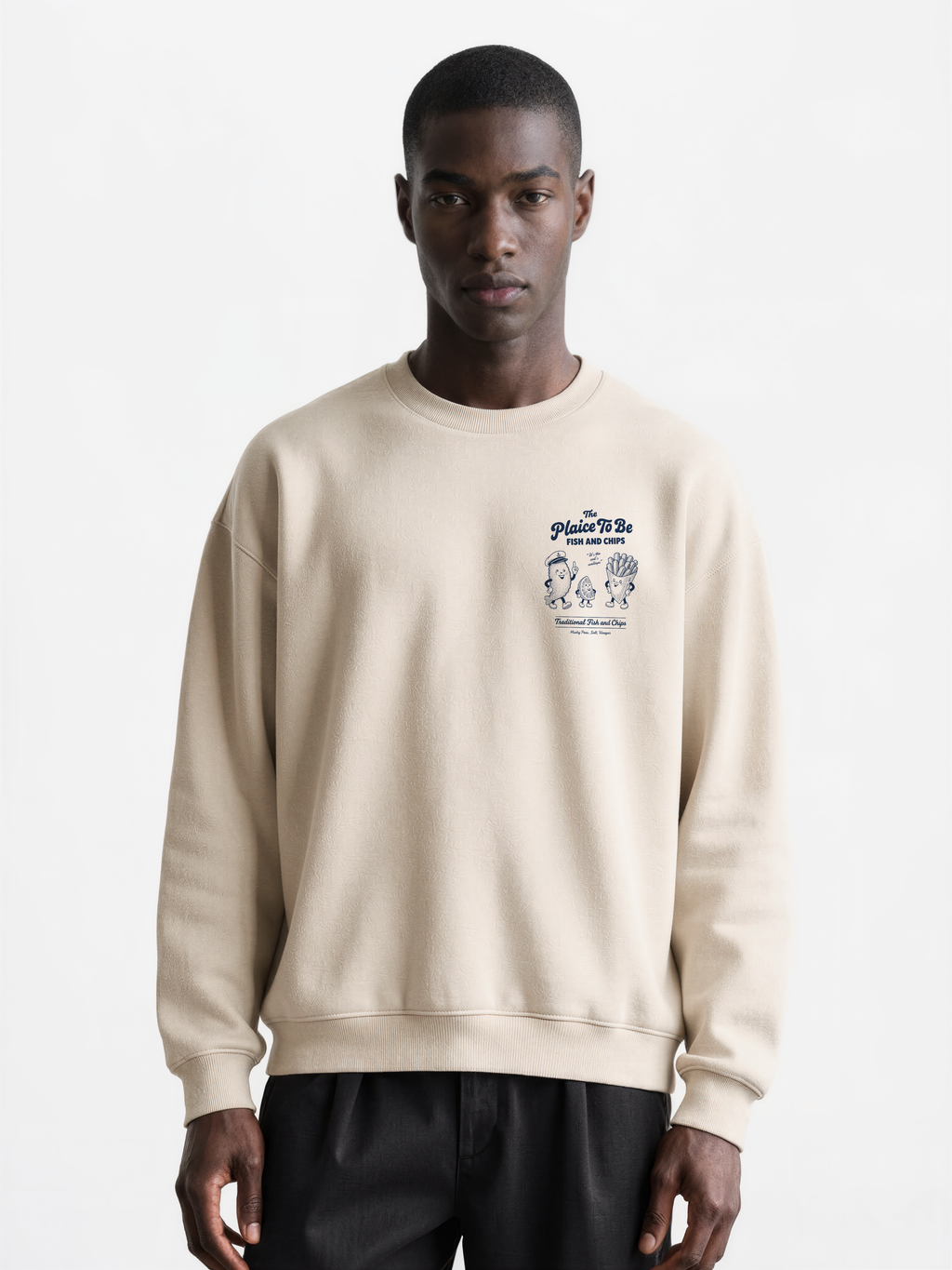 Stone Fish and Chips The Plaice To Be sweatshirt, male model front view with navy small left-chest graphic
