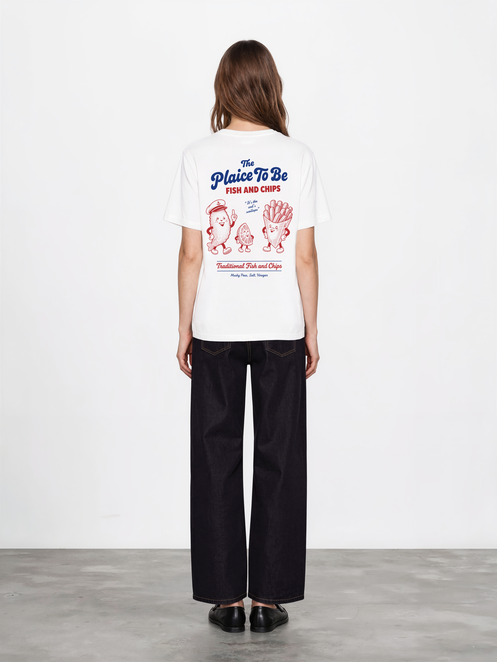 White Fish and Chips The Plaice To Be t-shirt, female model back view with red and blue large back graphic