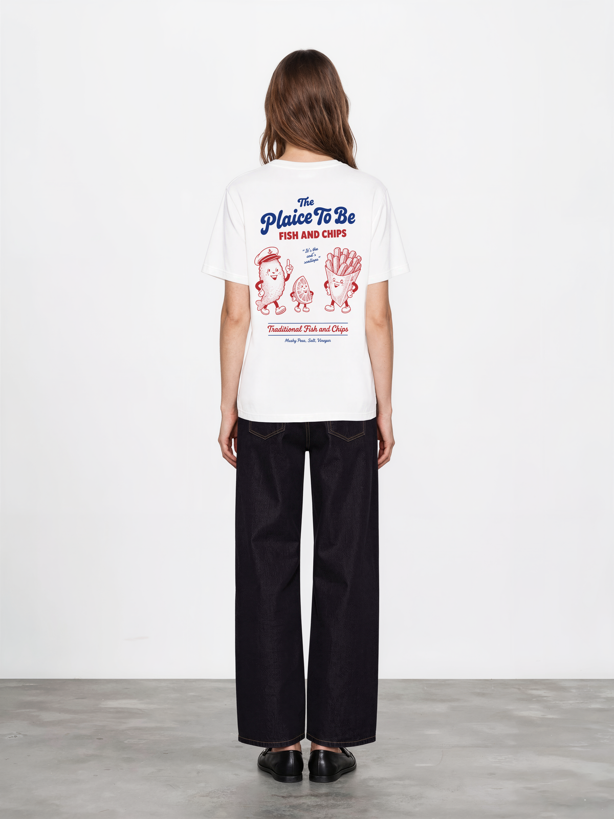 White Fish and Chips The Plaice To Be t-shirt, female model back view with red and blue large back graphic