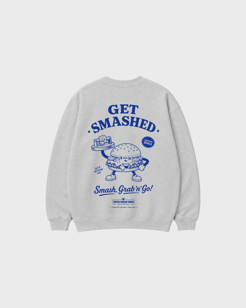 Back flat lay of the Get Smashed ash oversized sweatshirt, showing the large blue burger character and Get Smashed lettering.