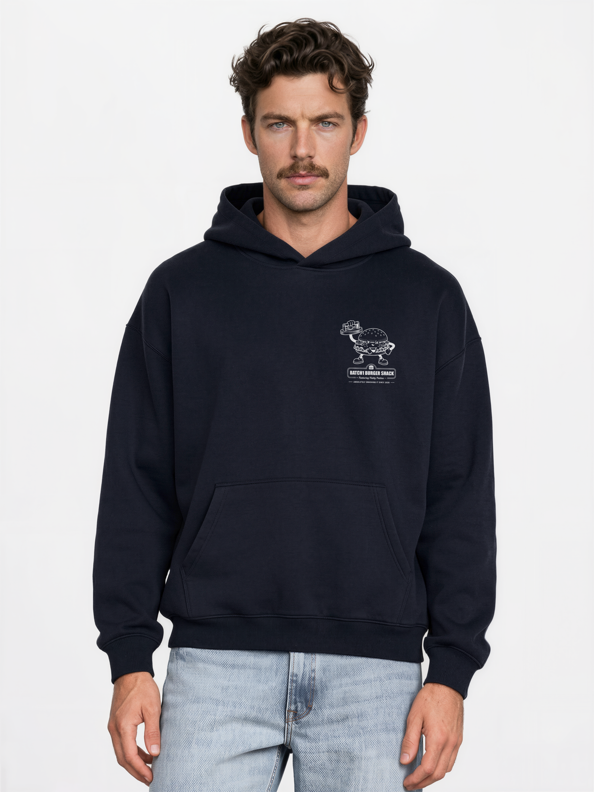 Male model wearing the Get Smashed navy oversized hoodie, front view showing the small white burger graphic on the left chest.