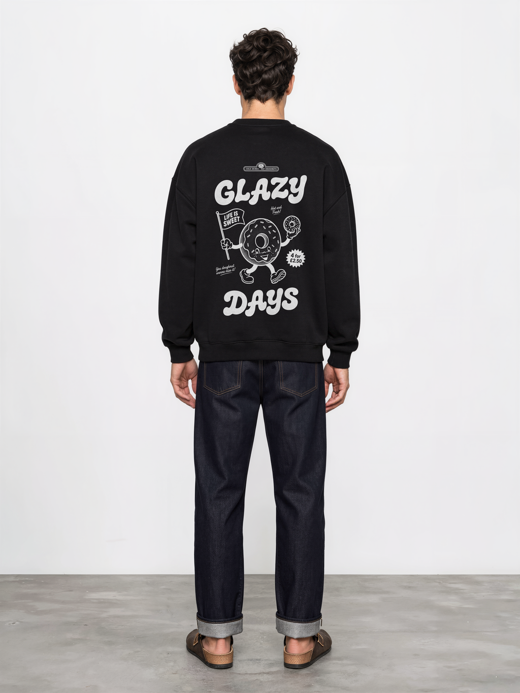 Glazy Days black sweatshirt, back male model, showing the larger white Glazy Days doughnut design on the back