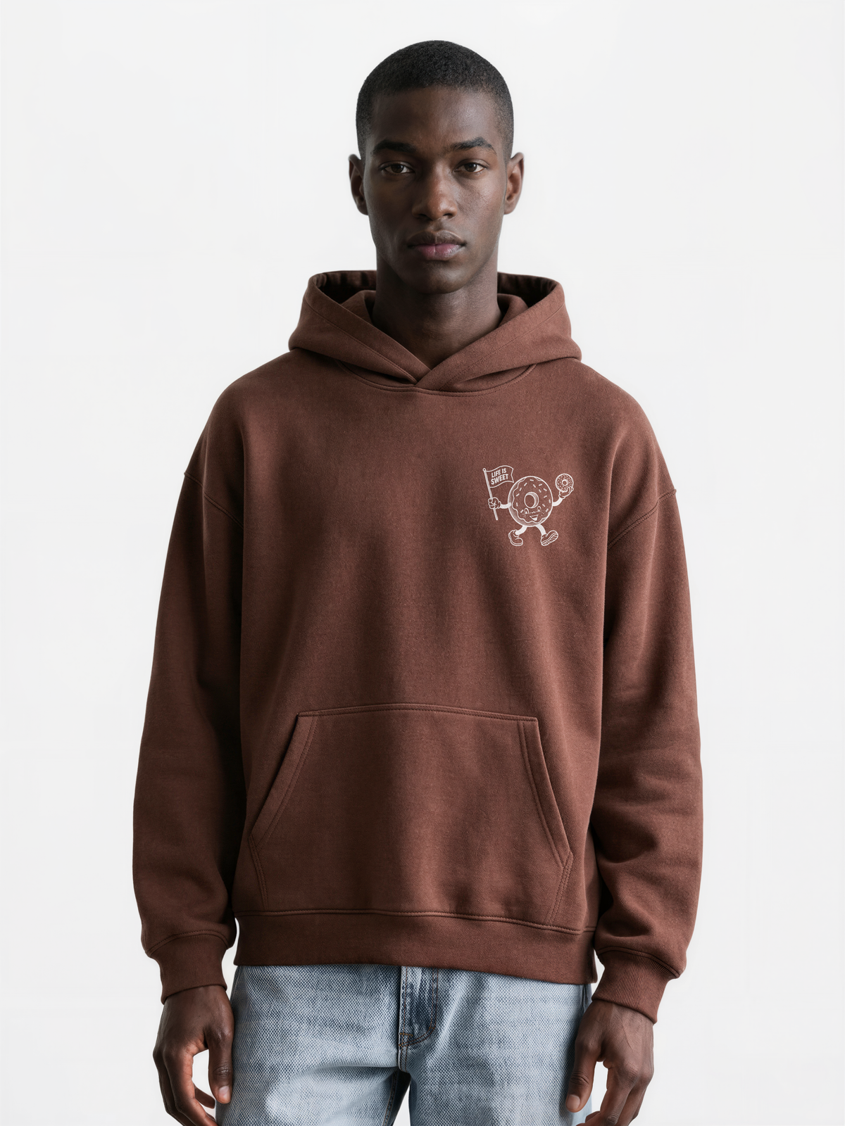 Glazy Days chocolate hoodie, front male model, showing a small white doughnut character chest print