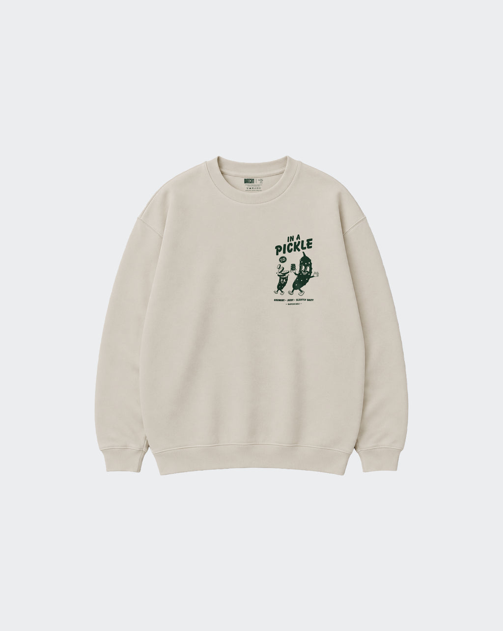 In a Pickle oversized stone sweatshirt, front view with dark green left chest graphic