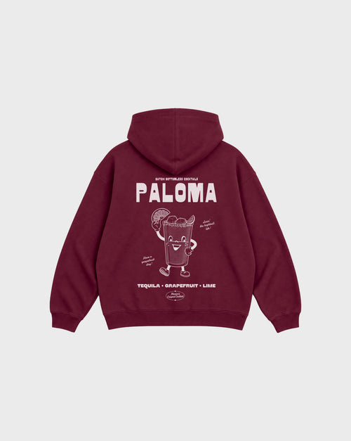 Paloma burgundy oversized hoodie, back flat lay showing the large white cocktail character graphic beneath the hood.