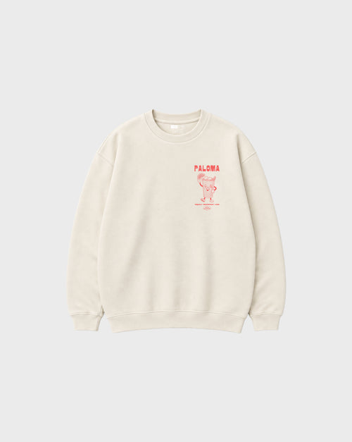 Paloma ivory oversized unisex sweatshirt, front flat lay showing the coral left-chest cocktail print.