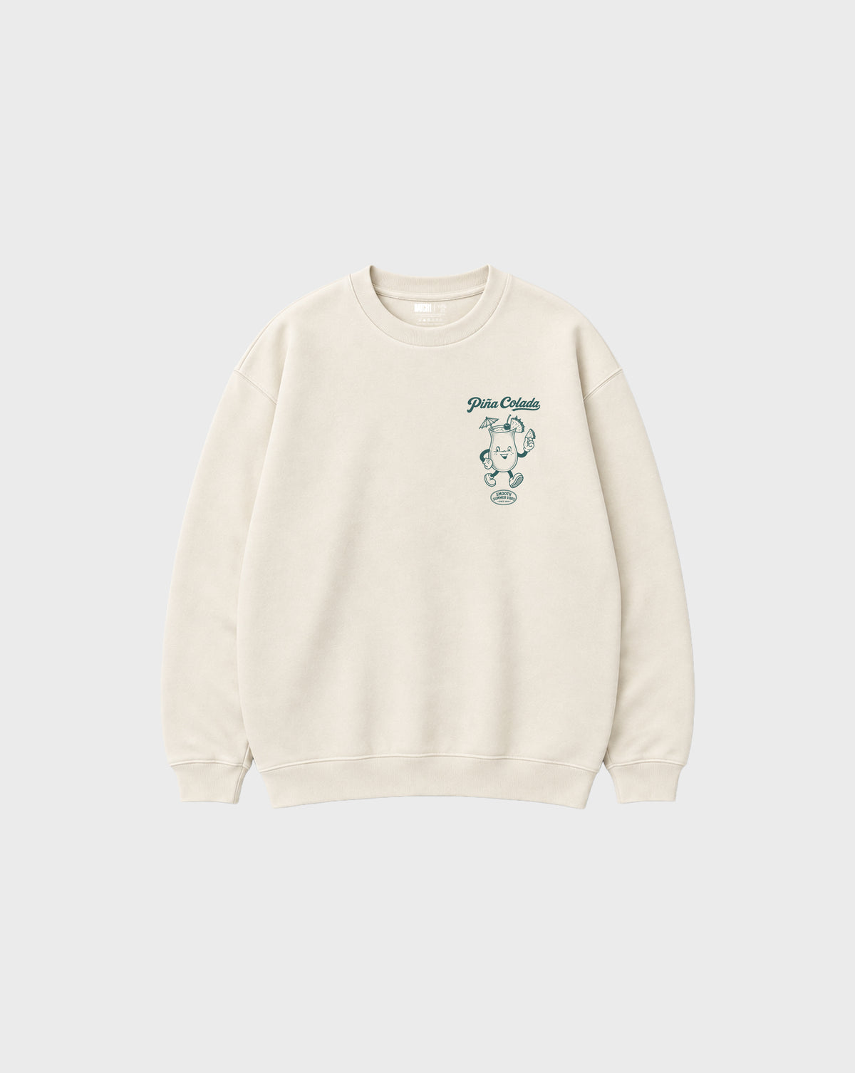 Front flat lay of the Piña Colada ivory oversized sweatshirt, showing the small teal Piña Colada cocktail print on the left chest.