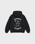 Back flat lay of the Señorito Burrito black oversized hoodie, showing the large white burrito character and lettering beneath the hood.