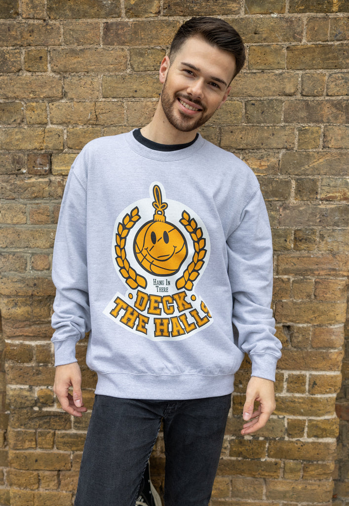 mens college style christmas jumper with happy bauble logo