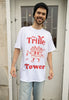 male model wears vintage style christmas t shirt in white with red printed trifle character and slogan