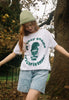 female model wears cute christmas slogan t shirt with gnome theme