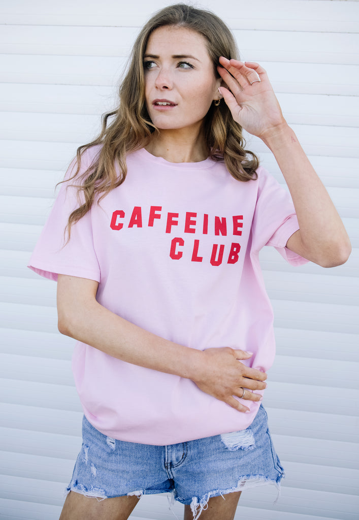 Model wears coffee slogan printed tshirt