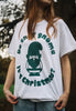 close up of christmas gnome t shirt in white with green print worn by female model